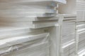 Stacks of polystyrene foam in packaging at a building materials warehouse in a store. The insulation is in the distribution wareho