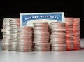 Stacks of pure silver coins with social security card Royalty Free Stock Photo