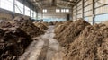 Stacks of Raw Peat in Industrial Plant Royalty Free Stock Photo