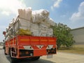 Stacks of recycled papers and foam and plastic garbage bags on the truck,Pile of trash on the truck