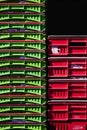 Stacks of Red and Green Plastic Storage Crates