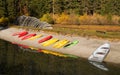 Stacks of Rental Boats Canoes Wait on the Beach Royalty Free Stock Photo