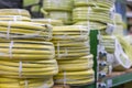 stacks of rolls yellow pvc plastic pipe on the counter in the store. Sale Hoses in the garden of various manufacturers, on shelves Royalty Free Stock Photo