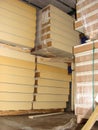 Stacks of stacked construction PIR panels for cold storage insulation, real construction site