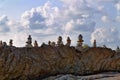 Stacks of stones at rock under cloudy sky. Thailand Royalty Free Stock Photo