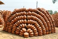 Stacks of Terracotta Pots Displayed Outdoors in an Artistic Arrangement Royalty Free Stock Photo