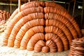 Stacks of Terracotta Pots Displayed Outdoors in an Artistic Arrangement Royalty Free Stock Photo