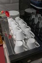 Stacks of upside down coffee cups prepared on machine Royalty Free Stock Photo