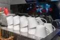 Stacks of upside down coffee cups prepared on machine Royalty Free Stock Photo
