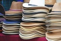 Stacks of variety hats on the street market