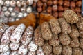 Stacks of various kinds of saucisson or saucisson sec - dry-cured sausages. Royalty Free Stock Photo