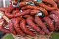 Stacks of various kinds of saucisson or saucisson sec - dry-cured sausages. Royalty Free Stock Photo