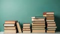 Stacks of various old books sit on clean white table. Different color book covers clearly visible. Image education, learning, Royalty Free Stock Photo