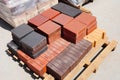 Stacks of various and for sale. Building and construction materials, colored concrete pavers (paving stone) or patio blocks organ