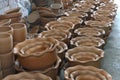 Stacks of various terracotta pots for plants