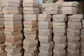 Stacks of various terracotta pots for plants for sale