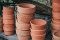 Stacks of vintage old clay flower pots on a rustic wooden surface Royalty Free Stock Photo