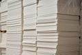 Stacks of white extruded polystyrene sheets insulative material for buildings stored in warehouse