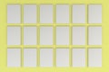 Stacks of white flyers on yellow background Royalty Free Stock Photo