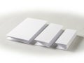 Stacks of white paper sheets on a light surface Royalty Free Stock Photo