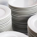 Stacks of white plates