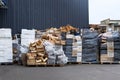 Stacks of wooden and plastic boxes at warehouse in store yard. Boxes and containers for transportation products by truck. Cargo Royalty Free Stock Photo