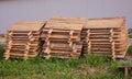 Stacks of wooden snail boards for Edible snails