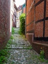 Stade, Germany - August 25, 2019: View at cobbled alley in beautiful historical part  in town of Stade, Germany Royalty Free Stock Photo