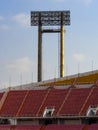 Stadium lighting with seat row and blue sky background Royalty Free Stock Photo