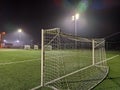 Stadium in lights and flashes. Empty beautiful football field with glowing spotlights in the evening or at night. Artificial turf Royalty Free Stock Photo