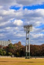 Stadium lights pole against blue sky, daytime Royalty Free Stock Photo