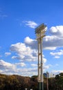 Stadium lights pole against blue sky, daytime Royalty Free Stock Photo