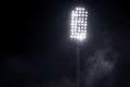 Stadium lights and smoke against dark night sky Royalty Free Stock Photo