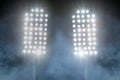 Stadium lights and smoke against dark night sky Royalty Free Stock Photo