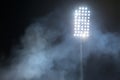 Stadium lights and smoke against dark night sky Royalty Free Stock Photo