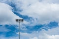 Stadium lights stand alone with blue sky Royalty Free Stock Photo