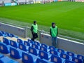 At the stadium before the match. Half empty stadium. Football stewards. Waiting for a football matc