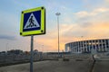 A stadium in the russian city at sunset. Traffic sign