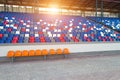 Stadiums amphitheater empty plastic seats in the stadium. Many empty seats for spectators in the stands for football fans and