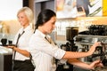 Staff at cafe making coffee espresso machine Royalty Free Stock Photo