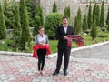 The staff of the hotel Mirage welcomes the guests with a treat at the entrance to the hotel in Poiana Brasov in Romania