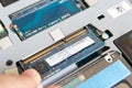 IT staff install DDR RAM into a slot on the mainboard of Laptop Royalty Free Stock Photo