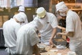 Staff making traditional chinese pork dumpling