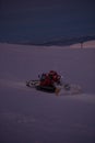 Tractor cleaning snow on the ski slopes in the Alps