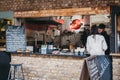 Staff at Roadkill street food stand inside Camden Market, London, UK Royalty Free Stock Photo