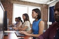 Staff Sitting At Desks Using Computers In Busy Office Royalty Free Stock Photo