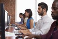 Staff Sitting At Desks Using Computers In Busy Office Royalty Free Stock Photo