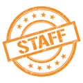 STAFF text written on orange vintage stamp