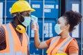 Staff worker check body temperature wearing face mask protect from Coronavirus or COVID-19 for new normal healthcare working