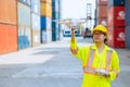 Staff worker using Drone aerial imaging system in port container yard. UAV Patrol flying guard technology for survey and security